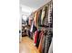 Spacious walk-in closet with ample shelving and hanging space for organized storage, enhanced by natural light at 2231 W 36Th Ave, Denver, CO 80211