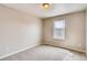 New carpet in bedroom with window and white painted walls and baseboards at 13374 Blue Amber Ct, Parker, CO 80134