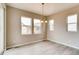 Bright dining room with large windows and ample natural light showcases neutral walls at 13374 Blue Amber Ct, Parker, CO 80134
