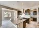 Modern kitchen with an island, stainless steel appliances, and a breakfast bar at 13374 Blue Amber Ct, Parker, CO 80134