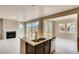 Open living space features a fireplace and large sliding doors leading to the backyard at 13374 Blue Amber Ct, Parker, CO 80134
