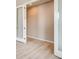 Empty room with white-painted walls, baseboards, and a door with frosted glass at 13374 Blue Amber Ct, Parker, CO 80134