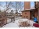 Backyard with deck, snow, and wooden fence at 7900 E Dartmouth Ave # 76, Denver, CO 80231