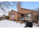 Backyard with deck and grill, snow on the ground at 7900 E Dartmouth Ave # 76, Denver, CO 80231