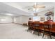 Finished basement bar with wood bar top, stools and plenty of space for entertaining at 7900 E Dartmouth Ave # 76, Denver, CO 80231