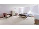 Main bedroom with carpeted floors, a dresser, and a chair at 7900 E Dartmouth Ave # 76, Denver, CO 80231