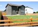 Spacious backyard, with lush green grass, a wooden fence, and a mulched area at 996 Kolz Pt, Elizabeth, CO 80107