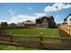 Large backyard with spacious green lawn and wood fence, perfect for outdoor activities at 996 Kolz Pt, Elizabeth, CO 80107
