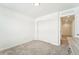 Bright bedroom with double door closet and access to hallway at 996 Kolz Pt, Elizabeth, CO 80107