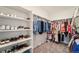 Large walk-in closet with ample shelving and hanging space for clothes and shoes at 996 Kolz Pt, Elizabeth, CO 80107