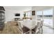 Bright dining area with table and chairs, adjacent to living room at 996 Kolz Pt, Elizabeth, CO 80107