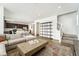 Open concept living room with a view of the kitchen, dining table, and staircase at 996 Kolz Pt, Elizabeth, CO 80107