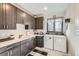 Bright laundry room, featuring washer, dryer and ample cabinetry at 11364 Birolli Pl, Littleton, CO 80125