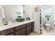 Bright bathroom with double vanity and decorative artwork at 1043 High Point Trl, Elizabeth, CO 80107