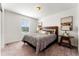 Cozy bedroom featuring stylish decor, carpet, and ample natural light at 1043 High Point Trl, Elizabeth, CO 80107