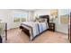 Comfortable bedroom with a large window, neutral carpet, and tasteful decor at 1043 High Point Trl, Elizabeth, CO 80107