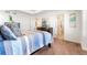 Cozy bedroom featuring neutral carpet, a dresser, and an ensuite bathroom at 1043 High Point Trl, Elizabeth, CO 80107