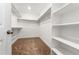 Walk-in closet with multiple racks, shelves, and plush carpet at 1043 High Point Trl, Elizabeth, CO 80107
