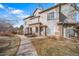 Townhouse exterior with stone accents and landscaping at 9468 E Florida Ave # 1047, Denver, CO 80247