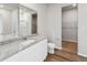 Bathroom featuring a granite vanity, a walk-in closet, and a shower at 2184 Alyssa St, Fort Lupton, CO 80621