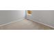 Bright bedroom featuring neutral carpet, base trim, and a window for natural light at 2184 Alyssa St, Fort Lupton, CO 80621