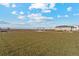 A neighborhood park offers benches and a covered picnic area in an open space to enjoy the outdoors at 2184 Alyssa St, Fort Lupton, CO 80621