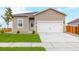 Charming single-Gathering home with a well-maintained lawn and a two-car garage at 2184 Alyssa St, Fort Lupton, CO 80621