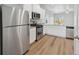 Modern kitchen features stainless steel appliances, white cabinets, and granite countertops at 2184 Alyssa St, Fort Lupton, CO 80621