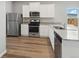 Modern kitchen features stainless steel appliances and granite countertops at 2184 Alyssa St, Fort Lupton, CO 80621