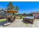 Spacious backyard oasis with hot tub, patio furniture, and umbrella at 6238 W 80Th Pl, Arvada, CO 80003