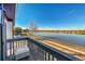 Private balcony overlooking the lake and community at 6238 W 80Th Pl, Arvada, CO 80003