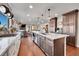 Modern kitchen with large island, stainless steel appliances, and ample counter space at 6238 W 80Th Pl, Arvada, CO 80003