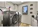 Laundry room featuring a side-by-side washer and dryer set at 6238 W 80Th Pl, Arvada, CO 80003