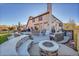 Large patio with fire pit and outdoor kitchen at 6238 W 80Th Pl, Arvada, CO 80003