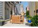 This backyard has a dining table with seating for six, as well as tasteful foliage and string lights at 1702 W 66Th Ave, Denver, CO 80221