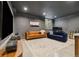 Finished basement features large tv area and a second area for an office at 1702 W 66Th Ave, Denver, CO 80221