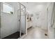 Updated bathroom featuring tiled shower with glass door at 1702 W 66Th Ave, Denver, CO 80221