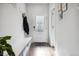 Bright entryway with a bench, coat hooks, and stylish decor at 1702 W 66Th Ave, Denver, CO 80221