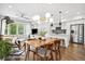 Spacious living area with hardwood floors, large windows, and an open layout at 1702 W 66Th Ave, Denver, CO 80221
