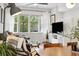 Bright living room with large windows providing natural light at 1702 W 66Th Ave, Denver, CO 80221
