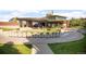 Serene outdoor lounge area with cushioned seating arranged around a manicured lawn at 1702 W 66Th Ave, Denver, CO 80221