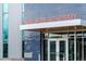 Exterior view of Trailside Academy with modern blue tile and prominent signage at 1702 W 66Th Ave, Denver, CO 80221