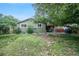 Expansive backyard with a patio, hot tub, and mature trees, perfect for enjoying the outdoors at 10462 Hoyt St, Westminster, CO 80021