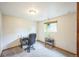 Bedroom featuring plush carpet and a bright window, perfect for a home office or guest room at 10462 Hoyt St, Westminster, CO 80021
