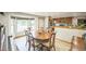 Bright dining area features a bay window and is open to an updated kitchen at 10462 Hoyt St, Westminster, CO 80021
