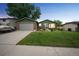 Charming single-Gathering home featuring a well-maintained lawn, mature trees, and an attached two-car garage at dusk at 10462 Hoyt St, Westminster, CO 80021