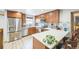 Modern kitchen featuring stainless steel appliances, custom cabinets, and ample counter space at 10462 Hoyt St, Westminster, CO 80021