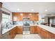 Modern kitchen featuring stainless steel appliances, custom cabinets, and ample counter space at 10462 Hoyt St, Westminster, CO 80021