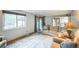 Bright living room featuring lots of natural light, sliding glass doors to the backyard, and comfortable seating at 10462 Hoyt St, Westminster, CO 80021