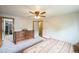 Neutral bedroom with a ceiling fan, closet, and light colored carpet at 10462 Hoyt St, Westminster, CO 80021